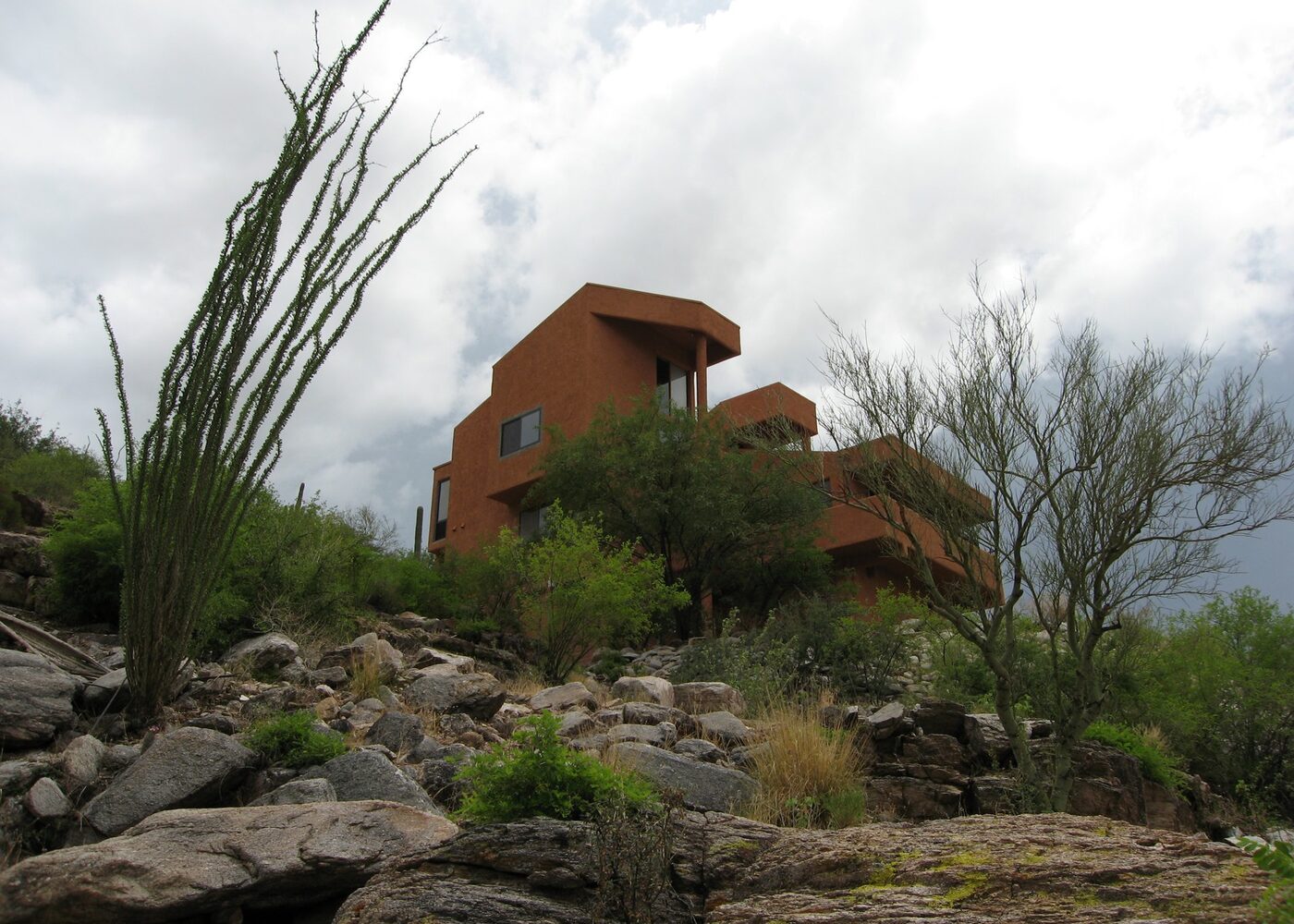 A Southwestern desert home on a hilltop among ocotillo and saguaro near Tucson